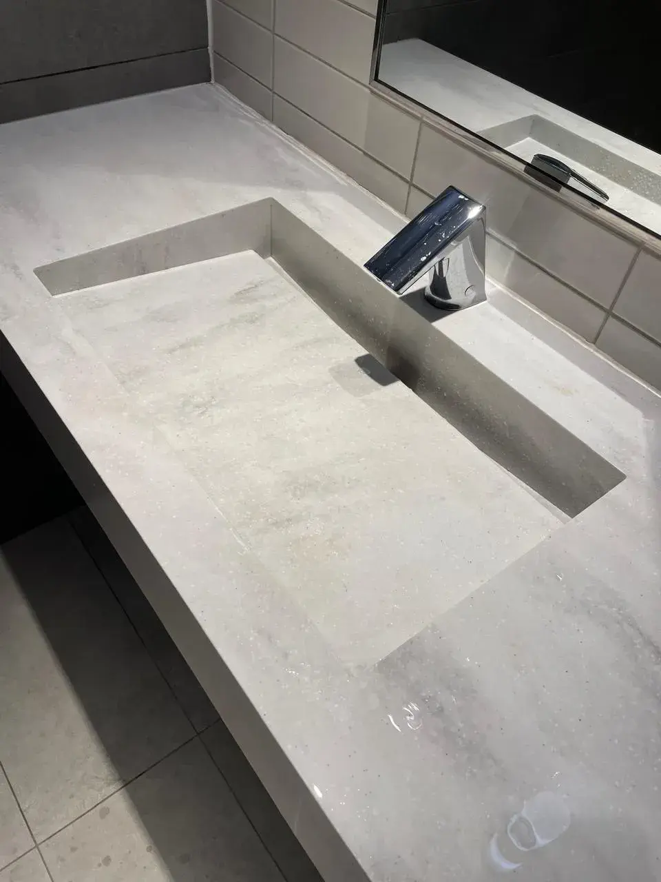 Commercial custom solid surface countertop with an integrated sink