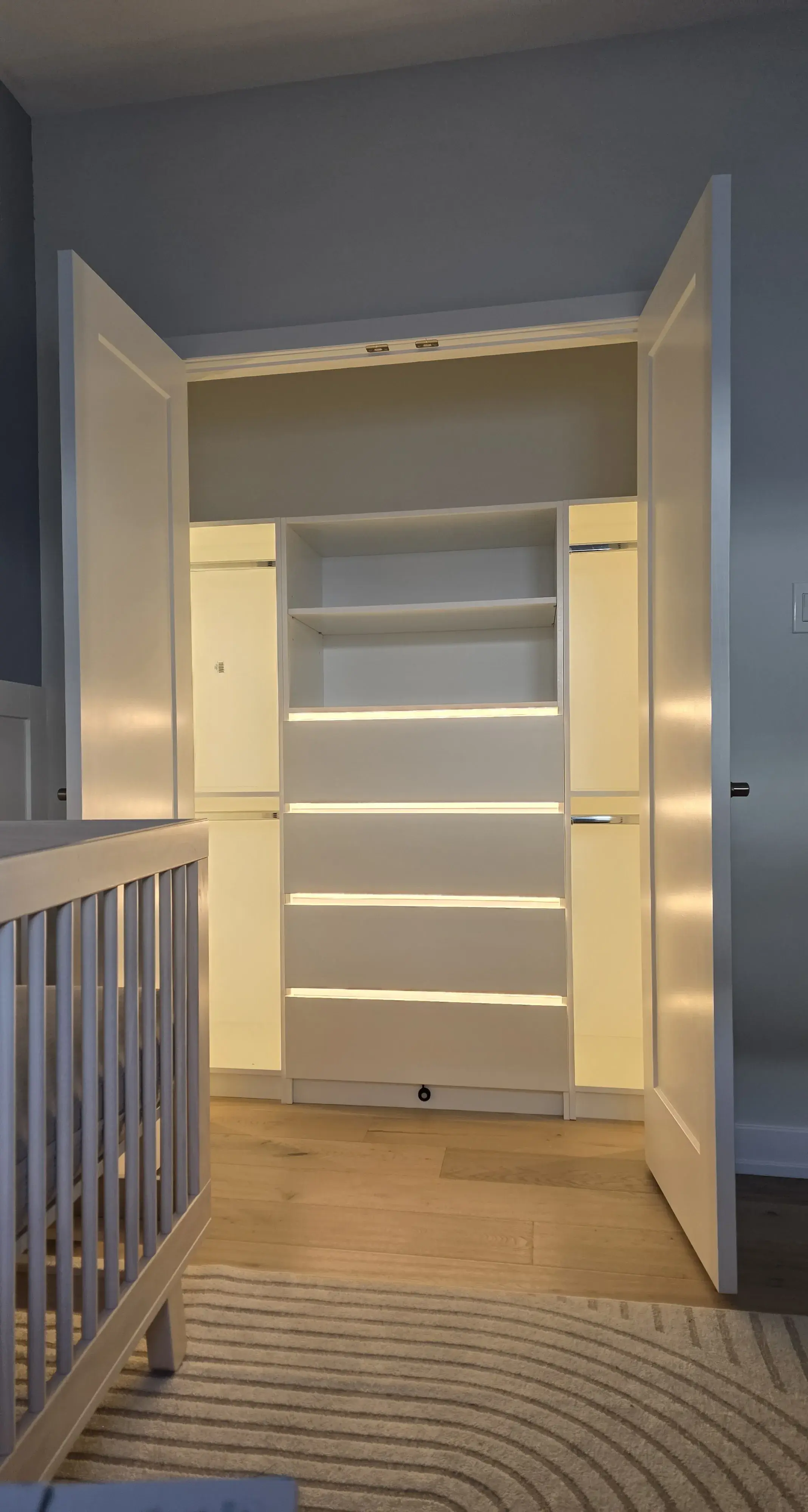 Custom reach-in closet with integrated LED lighting